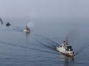 Iranian naval ships take part in a naval parade on the last day of the Velayat-90 war game in the Sea of Oman near the Strait of Hormuz in southern Iran January 3, 2012. REUTERS/Jamejamonline/Ebrahim Norouzi