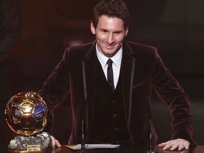 Lionel Messi won the Ballon d'Or 2011 trophy during FIFA's soccer awards ceremony in Zurich on Monday, Jan. 9, 2012. (REUTERS/Christian Hartmann)