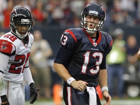 Houston Texans QB T.J. Yates (above) will face another rookie pivot, Bengals' Andy Dalton in Saturday's wildcard playoff game. (REUTERS)