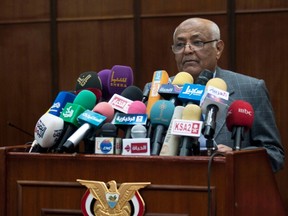 Yemen's newly-appointed Prime Minister Mohammed Salem Basindwa speaks in front of members of the House of Representatives during a board meeting on the government's plan of national reconciliation in Sanaa Dec. 24, 2011. (REUTERS/Mohamed al-Sayaghi)
