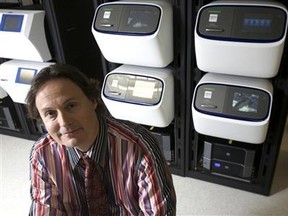 Ion Torrent CEO and chairman Jonathan Rothberg sits in front of the new Proton semi-conductor based genome sequencing machine in Guilford, Connecticut, Jan. 5, 2012. REUTERS/Michelle McLoughlin