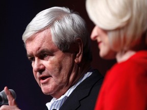 Republican presidential candidate and former U.S. Speaker of the House Newt Gingrich addresses supporters with his wife Callista at his side at his Iowa Caucus night rally in Des Moines, Iowa, January 3, 2012. (REUTERS/Jeff Haynes)