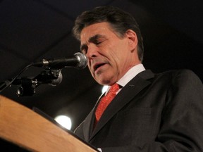 Republican presidential candidate and Texas Governor Rick Perry Rick Perry announces that he is going back to Texas to evaluate the results of the Iowa Caucus and how it might affect his campaign at his 2012 Iowa Caucus rally in Des Moines, Iowa, January 3, 2012.  (REUTERS/Samantha Sais)