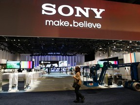 Workers prepare the booth for Sony at the Consumer Electronics Show opening in Las Vegas Jan. 9, 2012.  REUTERS/Rick Wilking