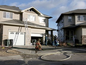 Strathcona County Emergency Services battled a blaze in Sherwood Park, Alberta, Jan. 11, 2012. Edmonton fire crews were called in to help battle the fire. Fire fighters managed to keep flames relatively under control despite high winds.            CATHERINE GRIWKOWSKY/24 HOURS/QMI AGENCY