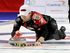Mike McEwen of Winnipeg uses a tuck slide as he delivers a rock during the final of the BDO Canadian Open of Curling at the K-Rock Centre in Kingston on Dec. 18 2011. (Ian MacAlpine/QMI Agency files)