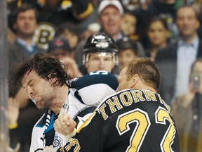 Boston Bruins right winger Shawn Thornton fights with Winnipeg Jets defenceman Mark Stuart during the second period on Tuesday at TD Garden in Boston. (BOB DECHIARA/US Presswire)