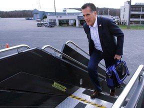 Republican presidential candidate and former Massachusetts Governor Mitt Romney boards his campaign plane in Bedford, Massachusetts, January 11, 2012, for a flight to South Carolina.  REUTERS/Brian Snyder