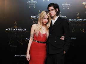 Peaches Geldof and Thomas Cohen pose for photographers at the Moet & Chandon Etoile Award for Mario Testino at the Park Lane Hotel in London, England, September 19, 2011. (REUTERS/Olivia Harris)