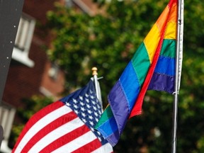 The U.S. flag is seen flying next to a rainbow flag symbolizing gay pride.(Reuters)