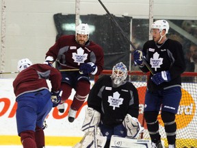 Mike Brown jumps out of the way of a David Steckel shot during Leafs practice on Wednesday. (Ernest Doroszuk, Toronto Sun)