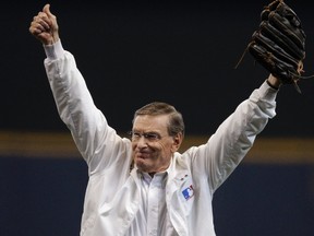 Commissioner of Major League Baseball Bud Selig gestures to the crowd after throwing out the opening pitch before the start of Game 5 of the MLB National League Divisional League Series baseball playoff between the Arizona Diamondbacks and the Milwaukee Brewers in Milwaukee, October 7, 2011. (REUTERS/Morry Gash/Pool)