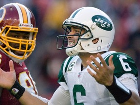New York Jets quarterback Mark Sanchez (6) complains to the referees after a play during the second half of their NFL football game against the Washington Redskins in Landover, Maryland, December 4, 2011. Washington Redskins defensive end Barry Cofield is at left.  (REUTERS/Jonathan Ernst)