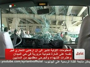 A bus is damaged after an explosion in the Maidan district of Damascus in this still image taken from video Jan. 6, 2012. A suicide bomber killed several people and wounded dozens in central Damascus on Friday, Syrian state television said. REUTERS/SYRIAN TV via REUTERS TV