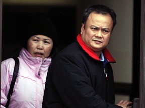 Sommit Luangpakham (R) and his wife leave the Ottawa Courthouse after he heard victim impact statements Friday, Jan. 6, 2012,  from some of the five cyclists he ran over in Kanata in 2009. (DARREN BROWN/QMI AGENCY)