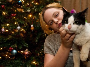 Hope Gulseth holds George the cat at her Leduc home on Tuesday, Dec. 20, 2011. (CODIE MCLACHLAN/QMI AGENCY)