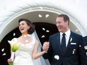 Peter MacKay and his dazzling bride Nazanin Afshin-Jam leave a chapel in Mexico Jan 4, 2012 amid smiles and rose petals. The political power couple married on Wednesday in Mexico surrounded by family and close friends. CREDIT: Alec & T. Photography