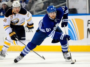 Phil Kessel pulls away from Paul Gaustad on Friday night in Buffalo. Kessel, the Leafs' leading scorer, and linemate Joffrey Lupul, have been held off the scoresheet the past two games. (Reuters)