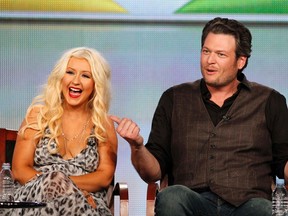 Coaches Christina Aguilera and Blake Shelton attend the panel for the NBC television series "The Voice" at the Television Critics Association winter press tour in Pasadena, California Jan. 6, 2012.  (REUTERS/Mario Anzuoni)