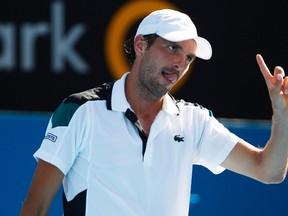 Julien Benneteau of France reacts during his semi-final match against Marcos Baghdatis of Cyprus at the Sydney International tennis tournament January 13, 2012. REUTERS/Daniel Munoz