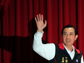 Taiwan President and Nationalist Party (KMT) presidential candidate Ma Ying-jeou waves to journalists as he attends a news conference after declaring his win in the presidential election in Taipei January 14, 2012. Incumbent Taiwan President Ma Ying-jeou claimed victory in the island's presidential election on Saturday, pointing to smooth future relations with China and the likelihood of stepped-up economic integration.  REUTERS/Ashley Pon