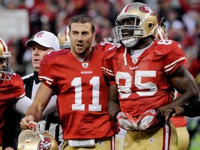 Niners QB Alex Smith (11) and tight end Vernon Davis celebrate after hooking up for the game-winning touchdown against the favoured New Orleans Saints on Saturday in San Fran. (Getty Images)