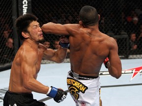 Yuri Alcantara elbows Michihiro Omigawa in the face during their featherweight bout last night in Rio de Janeiro, Brazil. Alcantara was one of four Brazilians to win his fight on UFC 142’s undercard. (ZUFFA LLC VIA GETTY IMAGES)