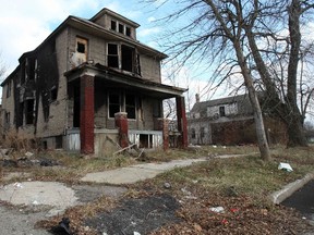 A partially burned, abandoned house is seen in Detroit, Michigan, January 7, 2012. REUTERS/Rebecca Cook