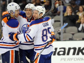 Edmonton Oilers left winger Taylor Hall, left, and centre Sam Gagner and right winger Ales Hemsky celebrate Hall's goal against the Dallas Stars during the first period at the American Airlines Center on Saturday.
Jerome Miron, US PRESSWIRE