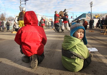 Griffin (l,8) and his brother Zennen(4) watches The Society For Creative Anachronism fighting at the Deep Freeze Festival on 118 ave and 94 st in Edmonton, Ab on Jan 7, 2012. The festival wraps up today.      PERRY MAH/EDMONTON SUN  QMI AGENCY