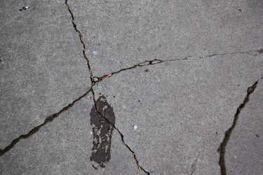A crack in a sidewalk south of 80 Avenue near 100 Street in Edmonton, Alberta on Sunday, January 8, 2012. AMBER BRACKEN/EDMONTON SUN/QMI AGENCY