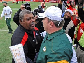 Kansas City Chiefs head coach Romeo Crennel (L) is congratulated by Green Bay Packers head coach Mike McCarthy after the Chiefs' win in their AFC-NFC NFL football game at Arrowhead Stadium in Kansas City, Missouri December 18, 2011. (REUTERS/Dave Kaup)