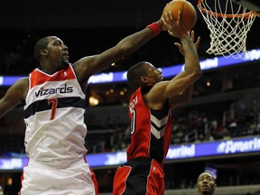 DeMar DeRozan of the Toronto Raptors (R) has his shot at the basket blocked by Washington Wizards' Andray Blatche on Tuesday in Washington.  (REUTERS/Jason Reed)