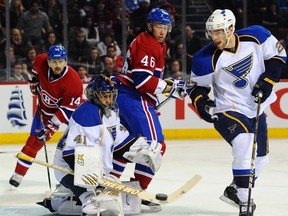 Blues goaltender Jaroslav Halak makes a save while being screened by Canadiens forward Andrei Kostitsyn at the Bell Centre in Montreal, Que., Jan. 20, 2012. (MARTIN CHEVALIER/QMI Agency)