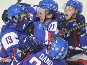 Martin Marincin, No. 21, celebrates with his Slovak teammates after scoring against Switzerland on New Year's Eve during the world junior. (QMI Agency file)