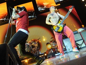 Anthony Kiedis and Flea  of Red Hot Chili Peppers performing live at the O2 Arena in London, England. (WENN.COM)