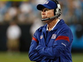 Giants head coach Tom Coughlin faces a tough challenge this weekend against Aaron Rodgers and the Packers. (REUTERS/Nell Redmond)