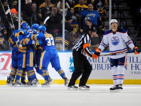 The Buffalo Sabres celebrate a goal against the Edmonton Oilers, as left wing Teemu Hartikainen (56) skates to the bench during the third period of their NHL hockey game in Buffalo, New York January 3, 2012.  (REUTERS/Doug Benz)