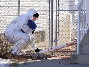 Forensics on scene near 93 Street and 103 Avenue. TOM BRAID\Edmonton Sun