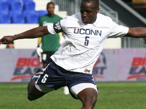 UConn defender Andrew Jean-Baptiste kicks the ball upfield against the St. John's Red Storm in the Championship game of the 2011 Big East Conference Men's Soccer Championship.
(Larry Levanti/Big East Conference/Collegiate Images/Getty Images)