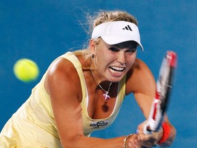 Caroline Wozniacki hits a return to Agnieszka Radwanska during the Sydney International, Jan. 11, 2012. (DANIEL MUNOZ/Reuters)