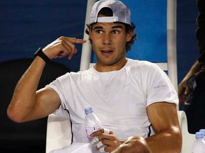 Rafael Nadal gestures during a training session at Rod Laver Arena in Melbourne on Thursday, Jan. 12, 2012. (REUTERS/Tim Wimborne)