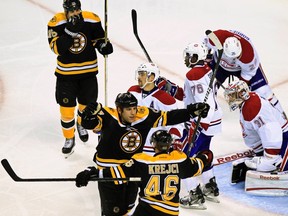 Bruins forward Milan Lucic celebrates with teammate David Krejci after scoring against the Canadiens at TD Garden in Boston, Mass., Jan. 12, 2012. (ADAM HUNGER/Reuters)