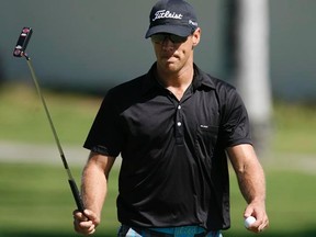 Graham DeLaet walks off the 16th green during the first round of the Sony Open in Honolulu, Hawaii on Thursday, Jan. 12, 2012. (REUTERS/Hugh Gentry)