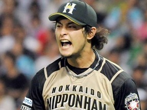 The Rangers won the right to negotiate with Japanese pitcher Yu Darvish with a record bid of $51.7 million. (AFP Photo/Jiji Press)