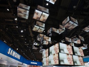 Video monitors are shown the Samsung Electronics booth at the 2012 International Consumer Electronics Show (CES) in Las Vegas, Nevada, Jan. 12, 2012. REUTERS/Steve Marcus