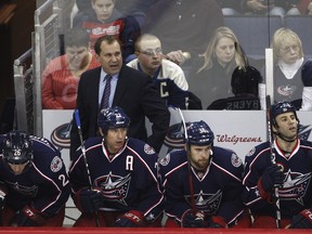 Blue Jackets interim head coach Todd Richards watches his team play against the Coyotes at Nationwide Arena in Columbus, Ohio, Jan. 13, 2012. (JOHN GRIESHOP/Getty Images/AFP)