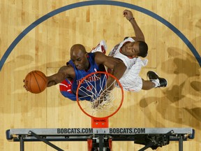 Pistons forward Damien Wilkins shoots against Bobcats guard Cory Higgins at Time Warner Cable Arena in Charlotte, N.C., Jan. 13, 2012. (KENT SMITH/NBAE via Getty Images/AFP)