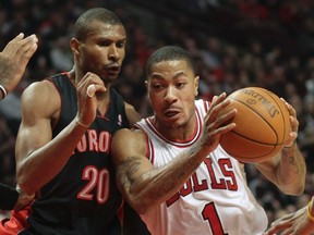 Bulls’ Derrick Rose shoots on Raptors’ Leandro Barbosa in Chicago. Barbosa was dealt to Indiana March 15, 2012. (Reuters files)