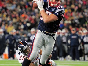 Patriots tight end Rob Gronkowski scores one of his three TDs against the Broncos on Saturday. (US Presswire)